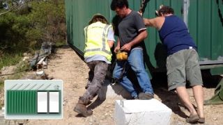 Shipping Container House - Placing the containers on foundations